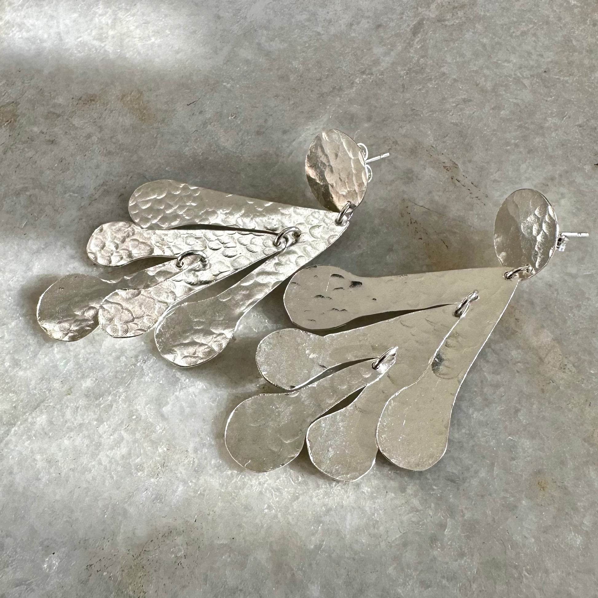 Sadie Earrings: handmade from recycled silver sycamore inspired abstract shapes hang and sway from a silver disc