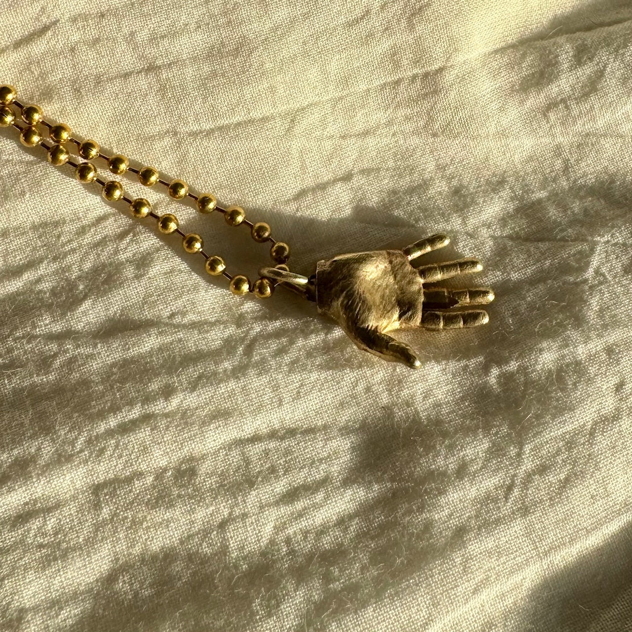HAND NECKLACE
