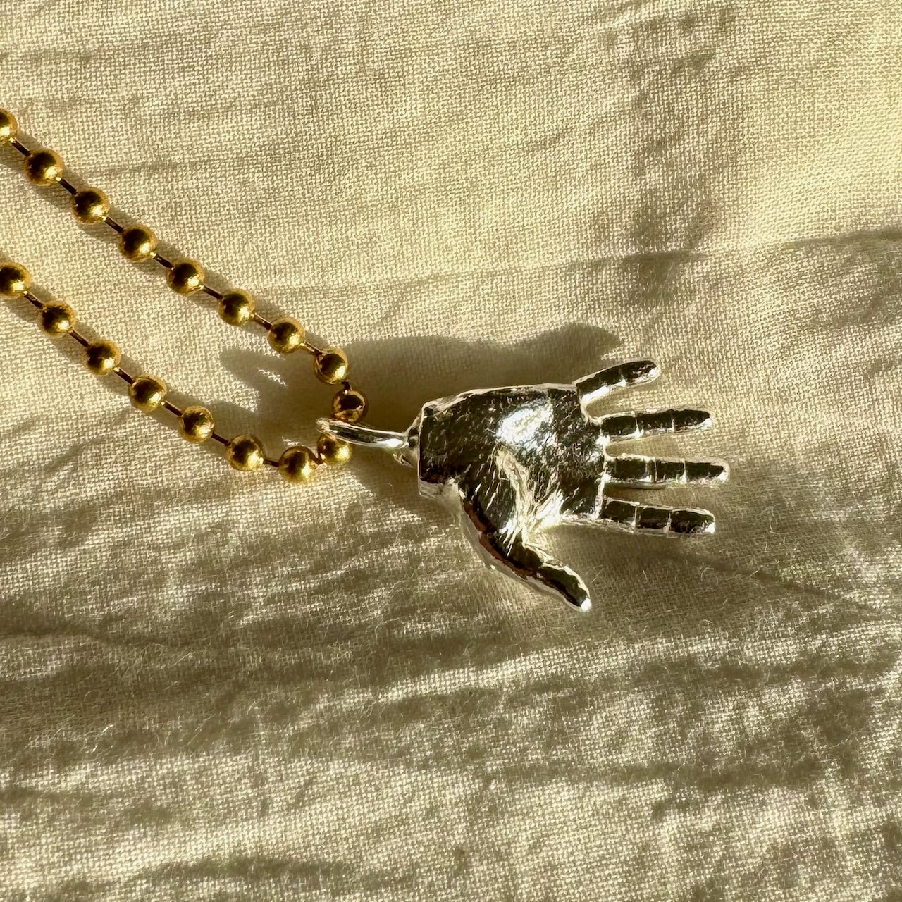 HAND NECKLACE
