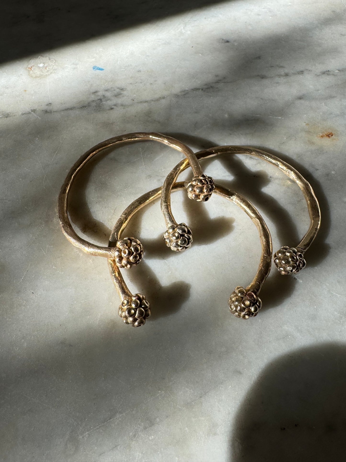MORA CUFF: handmade and cast in recycled bronze open cuffs with bobbles of smaller bobbles at the ends like blackberries. Fits all sizes.