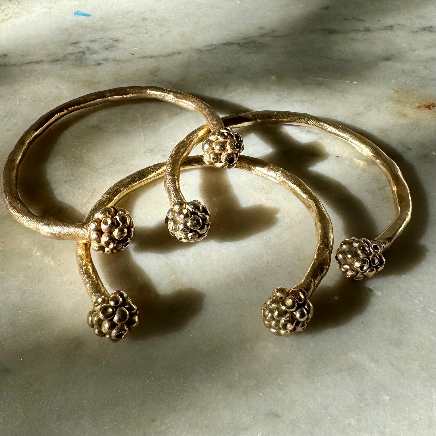 MORA CUFF: handmade and cast in recycled bronze open cuffs with bobbles of smaller bobbles at the ends like blackberries. Fits all sizes.