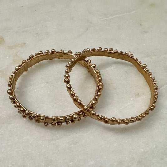 Beautiful bobble edged bangles reminiscent of the frilly bobbly edged kelp seaweed. Handmade in wax and cast in bronze.