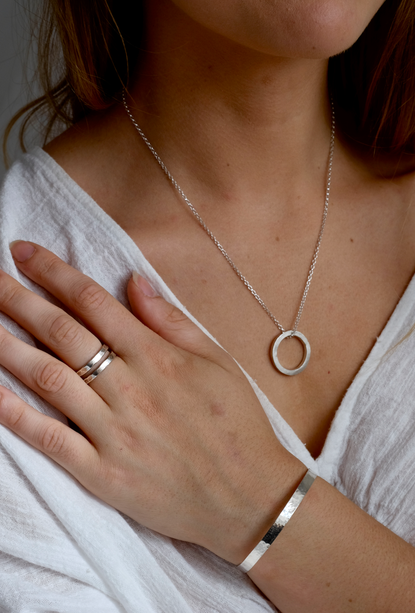 Silver Cuff Bracelet: simple recycled adjustable silver cuff. Worn by a model.