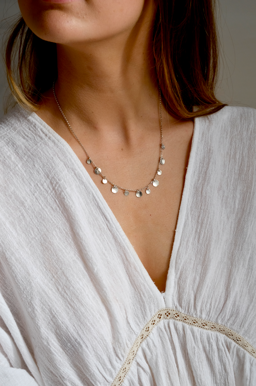 Rose Necklace: a handmade necklace featuring tiny discs of hammered recycled silver hanging from a recycled silver chain.
