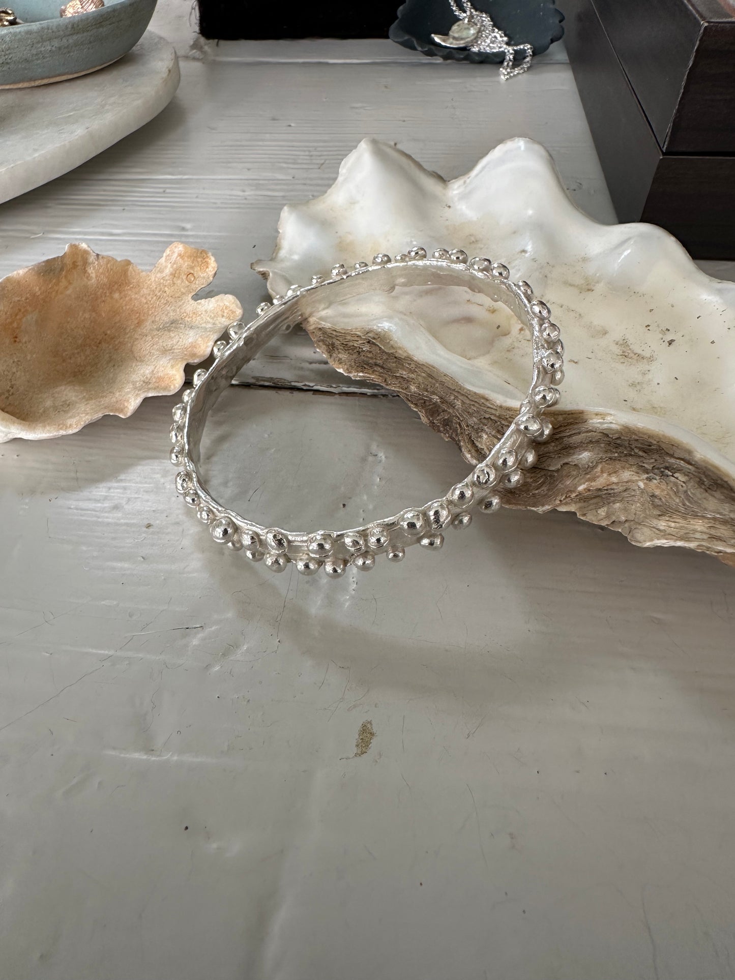 KELP BANGLES: Beautiful bobble edged bangles reminiscent of the frilly bobbly edged kelp seaweed. Handmade in wax and cast in recycled silver.