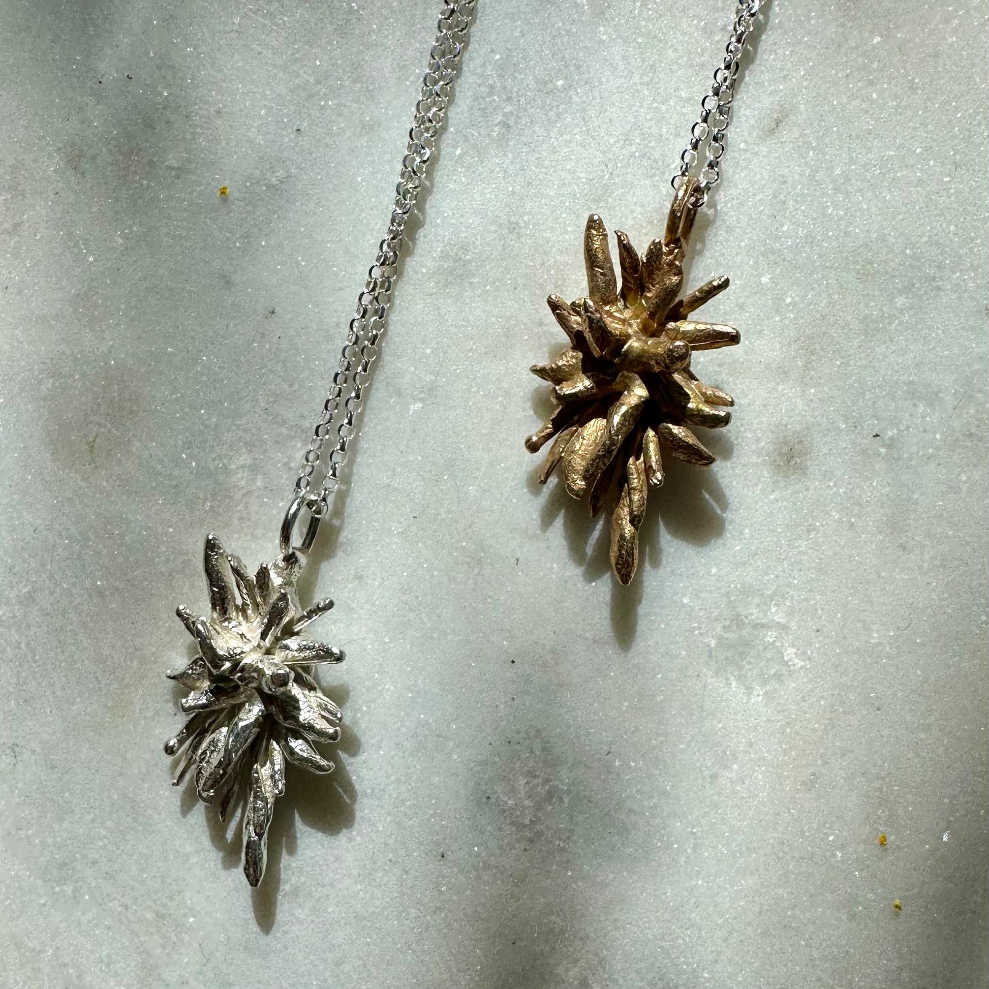 DEW OF THE SEA NECKLACE: softly spiky sea rosemary charms in recycled brass and recycled silver  hang from recycled silver chains.