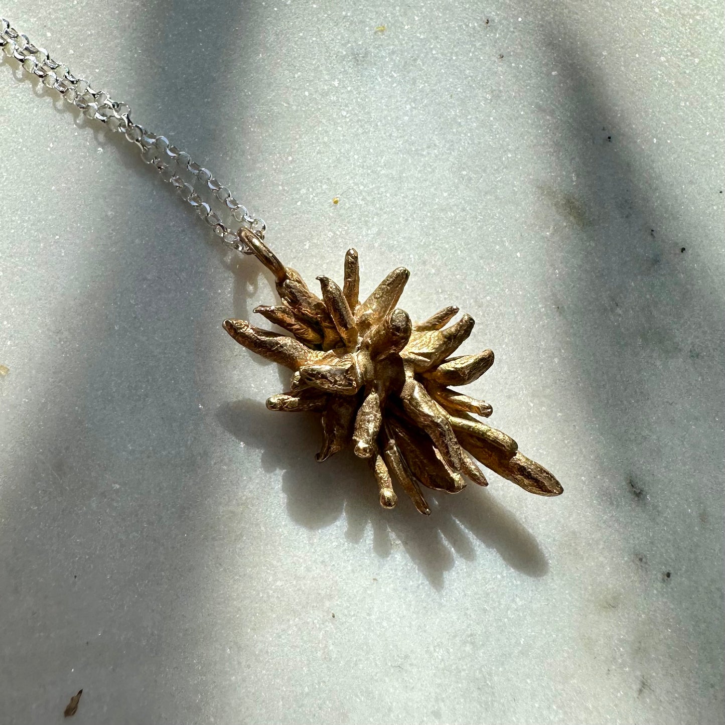 DEW OF THE SEA NECKLACE: softly spiky sea rosemary brass charms hang from recycled silver chains.