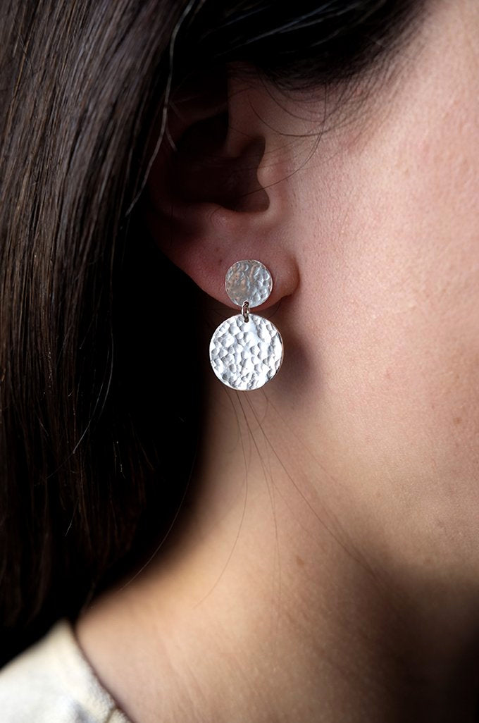 Silver Double Disc Earrings: striking but simple handmade recycled silver earrings. Worn by a model.