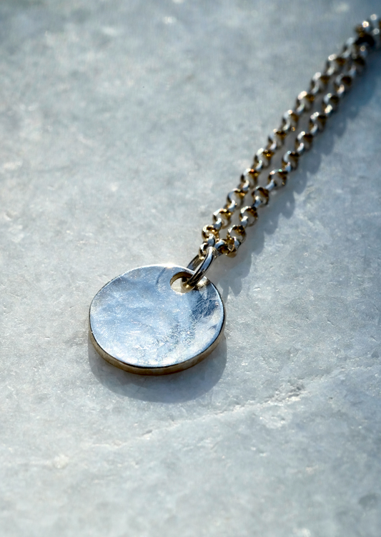 Letty Necklace: a sweet simple necklace with a hand textured recycled silver disc on a recycled silver chain.
