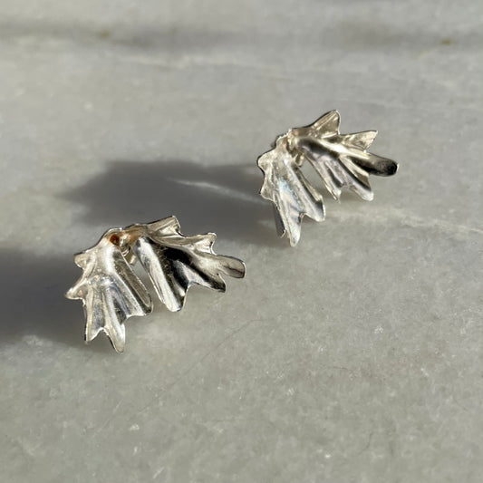 Sea Kale Studs: handmade recycled silver earrings in the folded shape of a sea kale leaf.