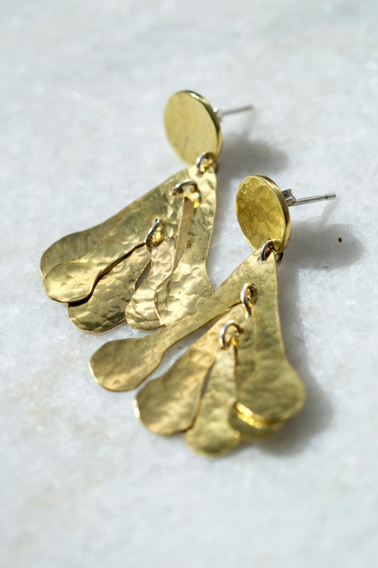 Sadie Earrings: handmade from recycled brass sycamore inspired abstract shapes hang and sway from a brass disc.