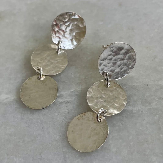 Three Moons Earrings: handmade earrings with three discs of hammered, recycled silver.