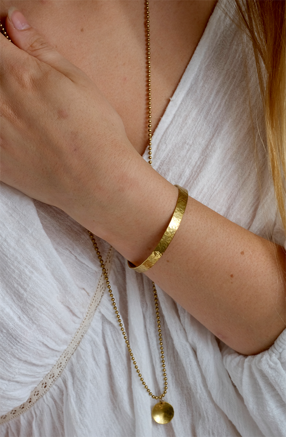 Brass Cuff Bracelet: simple recycled adjustable brass cuff, worn by a model.