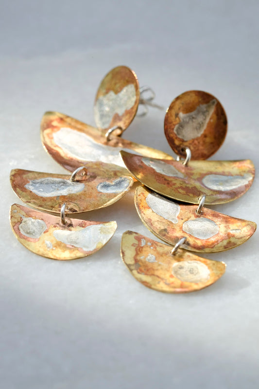 Lyla Earrings: handmade brass earrings with three half moon shapes in brass with molten swirls of recycled silver.