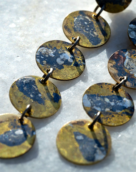 Nada Earrings: uniquely patterned brass disc earrings with swirls of molten recycled silver.
