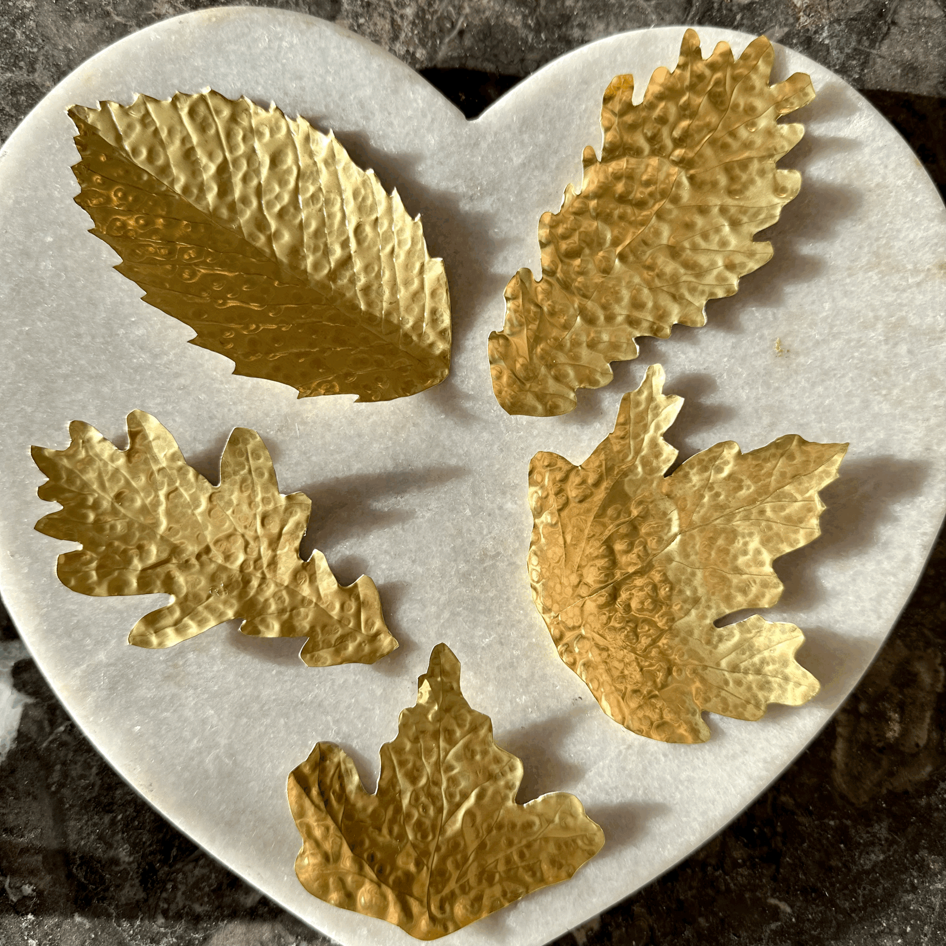 Brass Leaves: handcut and textured leaves fashioned by drawing around the leaves that fall about my workshop.