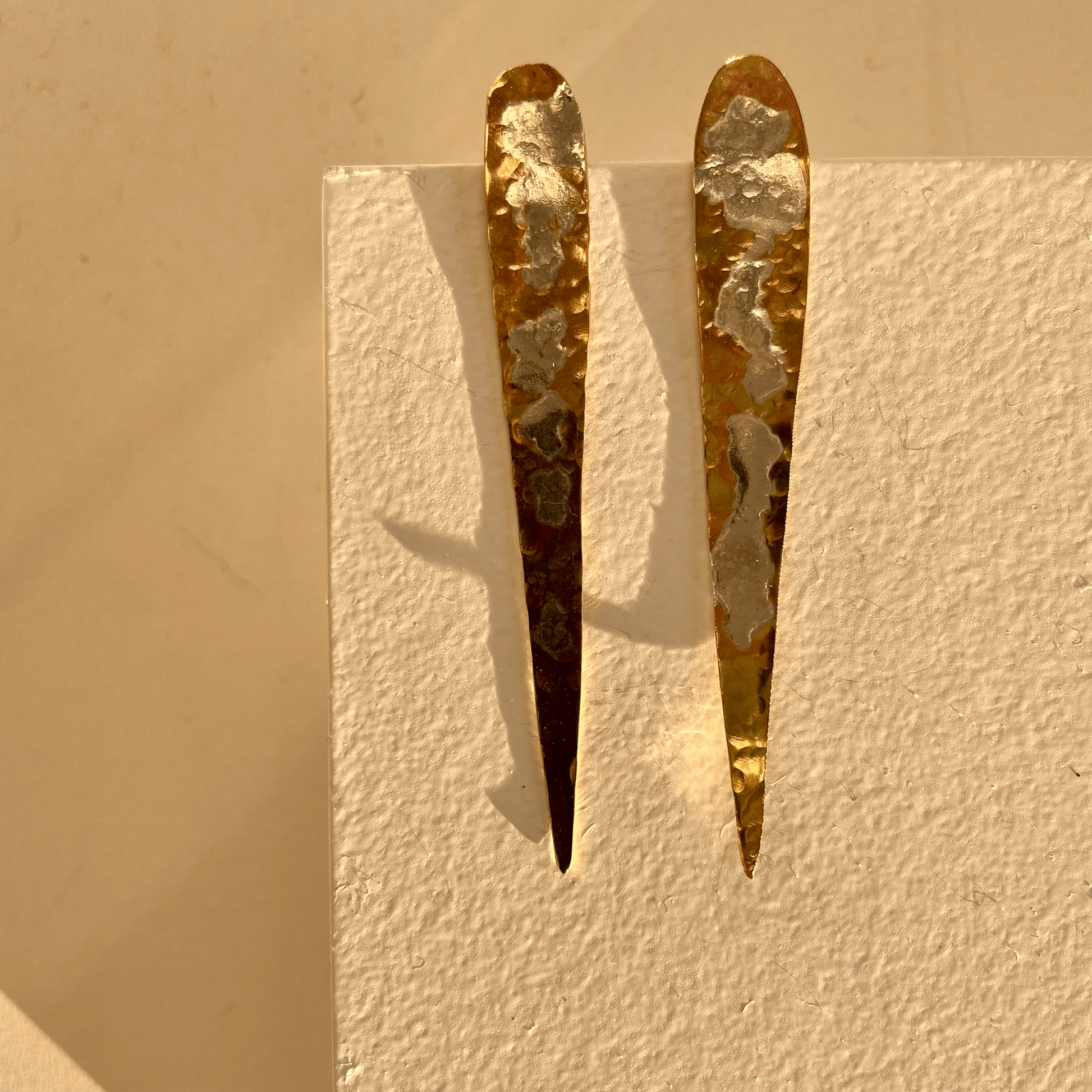 Sea Lichen Shards: handmade earrings in recycled brass with a mother silver patina inspired by lichen on the rocks by the sea.